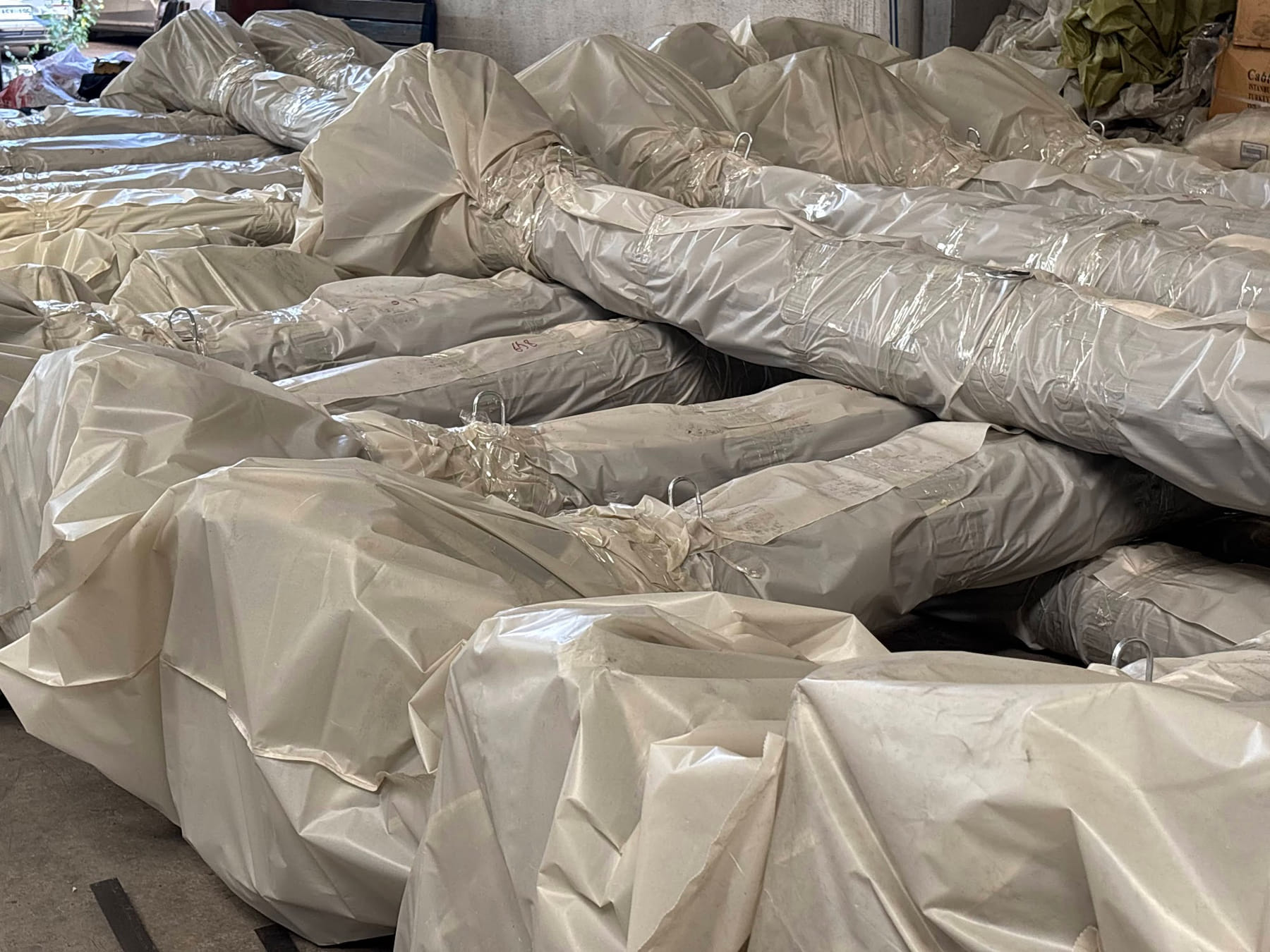 Stacks of wrapped wire bundles in the warehouse, ready for shipment